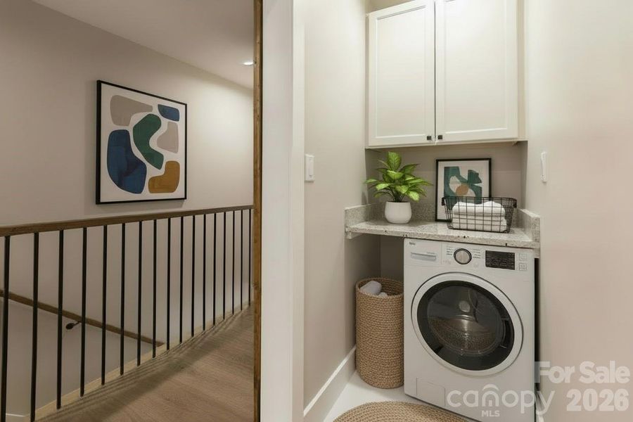 Convenient laundry area located between both primary suites. Convenient laundry area located between both primary suites.