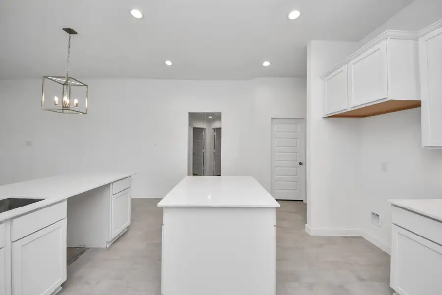 This generously spacious kitchen is a dream realized! Sample photo of completed home with similar floor plan. Actual colors and selections may vary.
