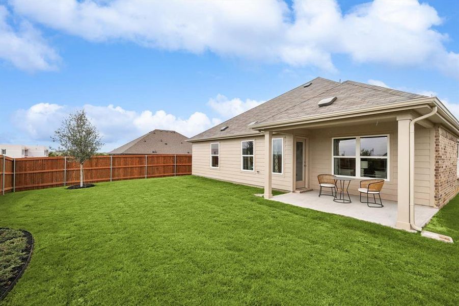 Back of house with a patio, a fenced backyard, and roof with shingles