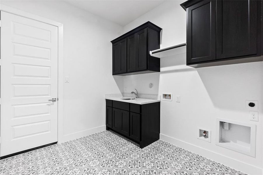 Utility Room with Sink, Washer and Dryer Connections, Hanging Bar, and Storage Cabinets