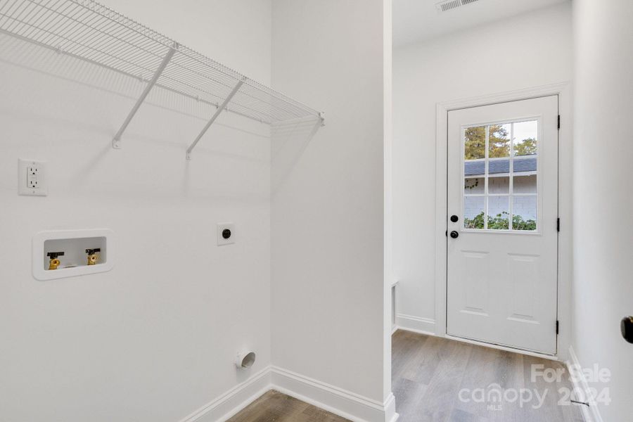 Back Door leading into Laundry and Mud Room