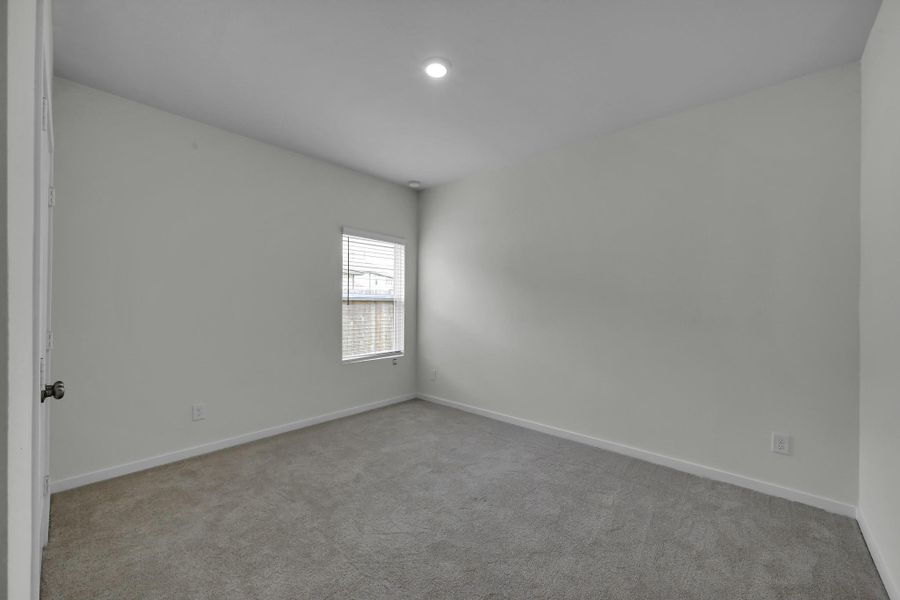 Secondary bedroom with convenient access to a private full bathroom, ideal for guest or mutigenerational living. Secondary bedroom with convenient access to a private full bathroom, ideal for guest or mutigenerational living.