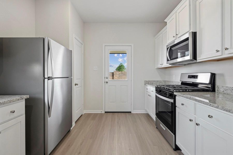 Furnished interior view inside a new home in Canterra Creek, Iowa Colony (Image 5).