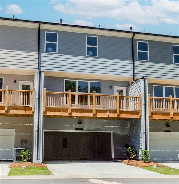 Front exterior of a new home in Hillcrest Landing, Sugar Hill, GA, highlighting curb appeal (Image 28). Front exterior of a new home in Hillcrest Landing, Sugar Hill, GA, highlighting curb appeal (Image 28).