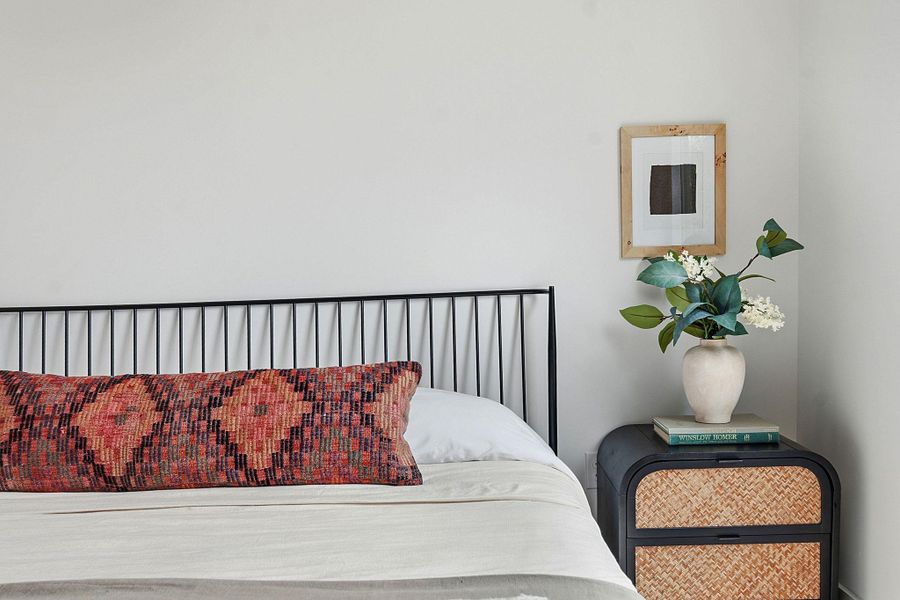 Bedroom featuring a black metal headboard