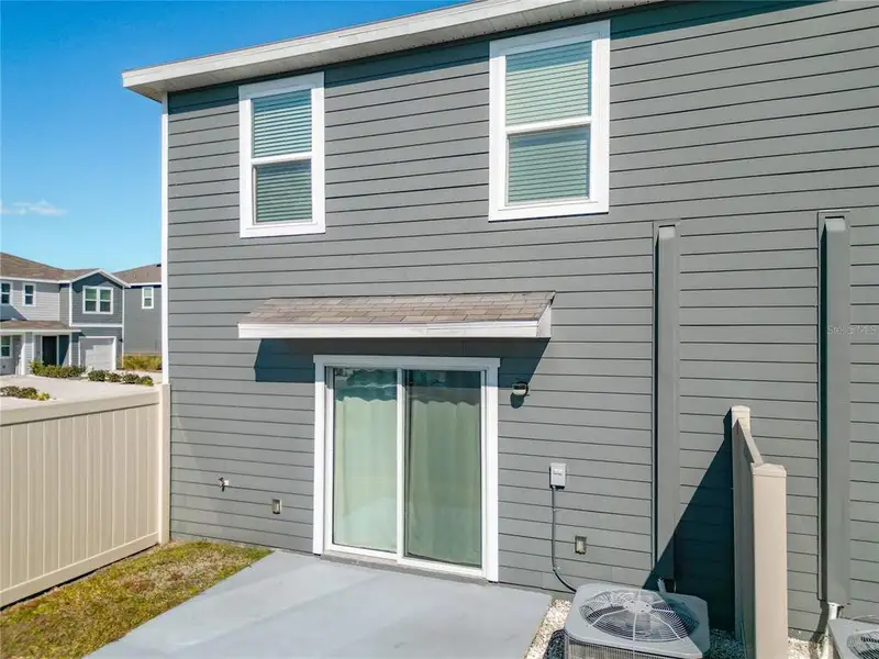 Exterior details and patio area of a home in The Towns at Laurel Commons, Ocala (Image 3).