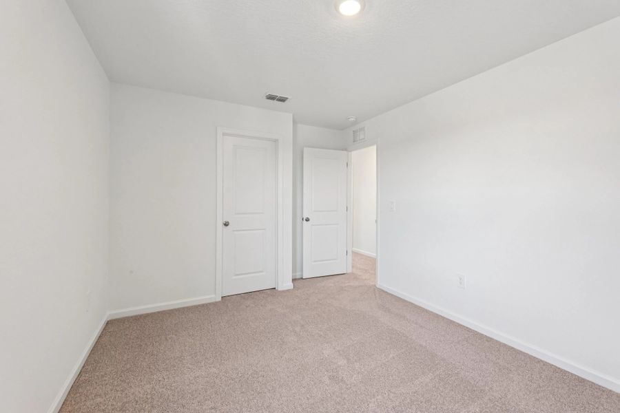 Representative unfurnished interior of a home built from the Ellis by Starlight Homes in Hawks Run, Kissimmee (Image 19).