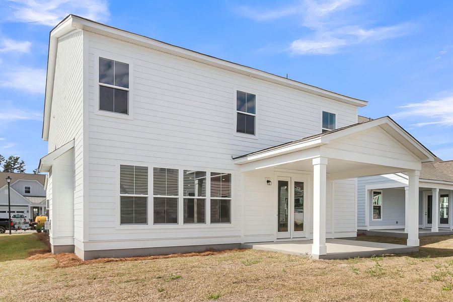 Exterior details and patio area of a home in Tidewater at Lakes of Cane Bay, Summerville (Image 3).