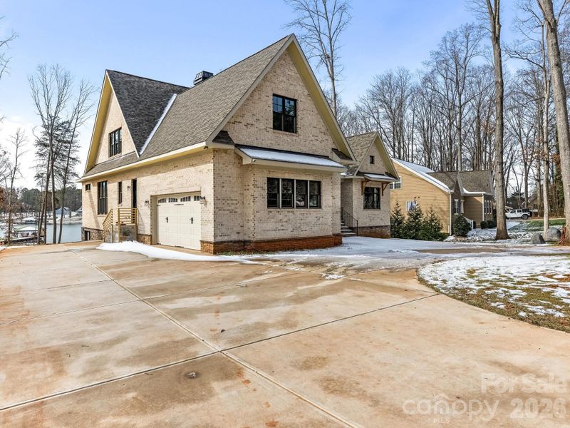 Side entry oversized garage w circular drive.