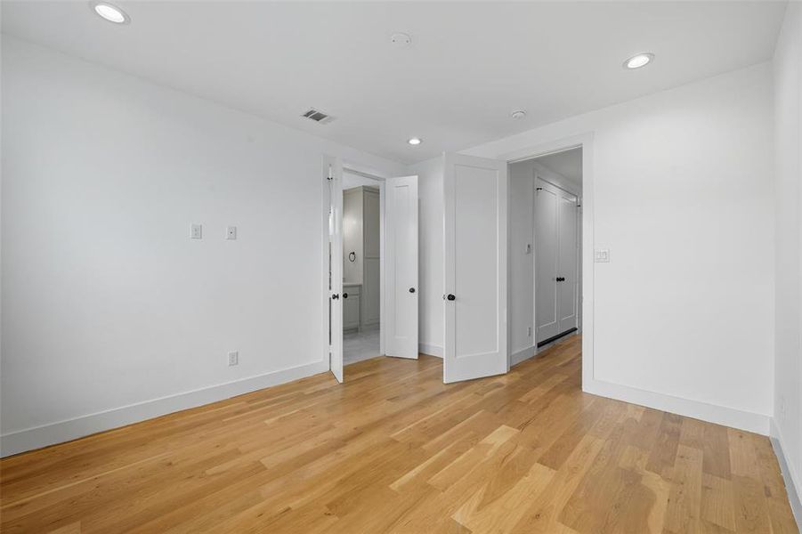 Unfurnished room with recessed lighting and light wood finished floors