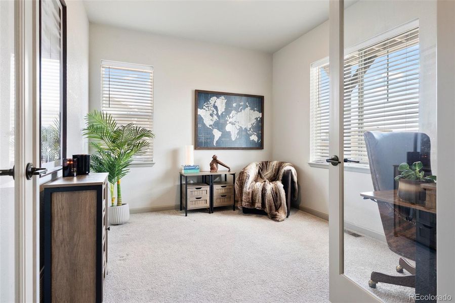 Stylish, comfortable office with lovely French Doors.