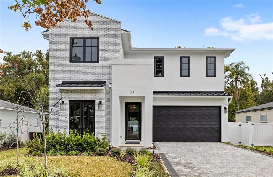 Front exterior of a new home in College Park, Orlando, FL, highlighting curb appeal (Image 2). Front exterior of a new home in College Park, Orlando, FL, highlighting curb appeal (Image 2).