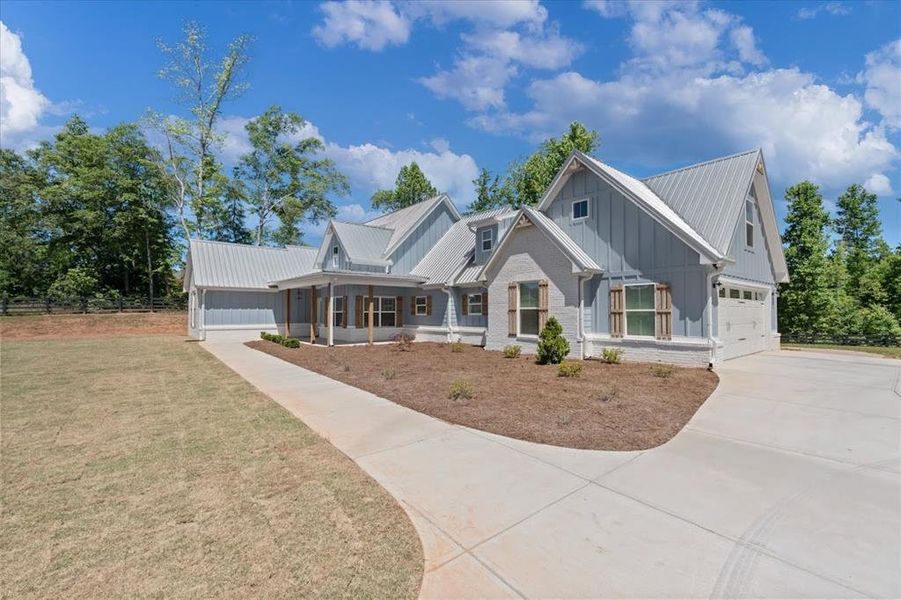 Front exterior of a new home in , Carrollton, GA, highlighting curb appeal (Image 13).