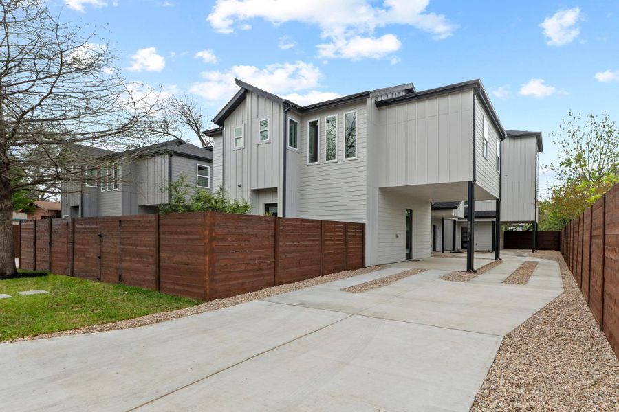 View of side of home with board and batten siding and a patio area