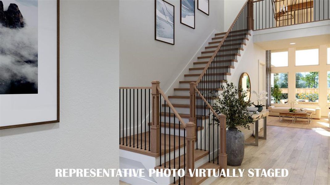 Step into our beautiful Ashland III dream home and be greeted by a gorgeous stair case featuring open railings and sight lines through to the rear of the home.  REPRESENTATIVE PHOTO VIRTUALLY STAGED