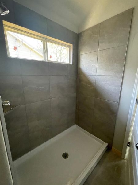 Bathroom with a tile shower