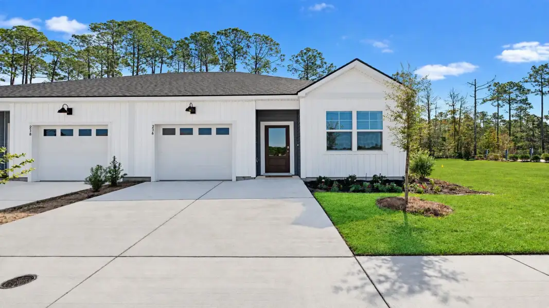 Front exterior of a new home in Altama, Brunswick, GA, highlighting curb appeal (Image 1). Front exterior of a new home in Altama, Brunswick, GA, highlighting curb appeal (Image 1).