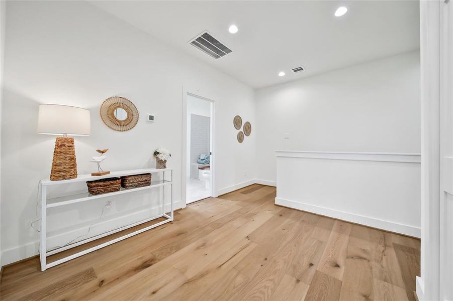 This photo was taken in another staged property with the same finishes and layout. Second floor landing.