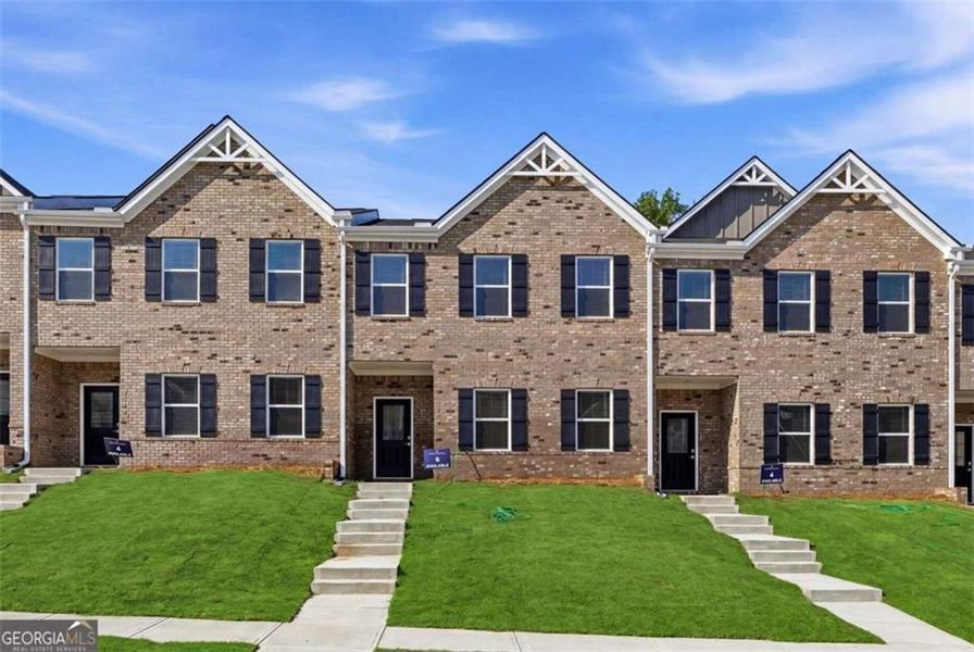 Front exterior of a new home in Parkway James, Snellville, GA, highlighting curb appeal (Image 2). Front exterior of a new home in Parkway James, Snellville, GA, highlighting curb appeal (Image 2).