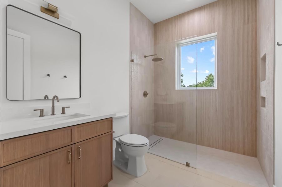 Spa-inspired secondary bath offering timeless finishes. Spa-inspired secondary bath offering timeless finishes.
