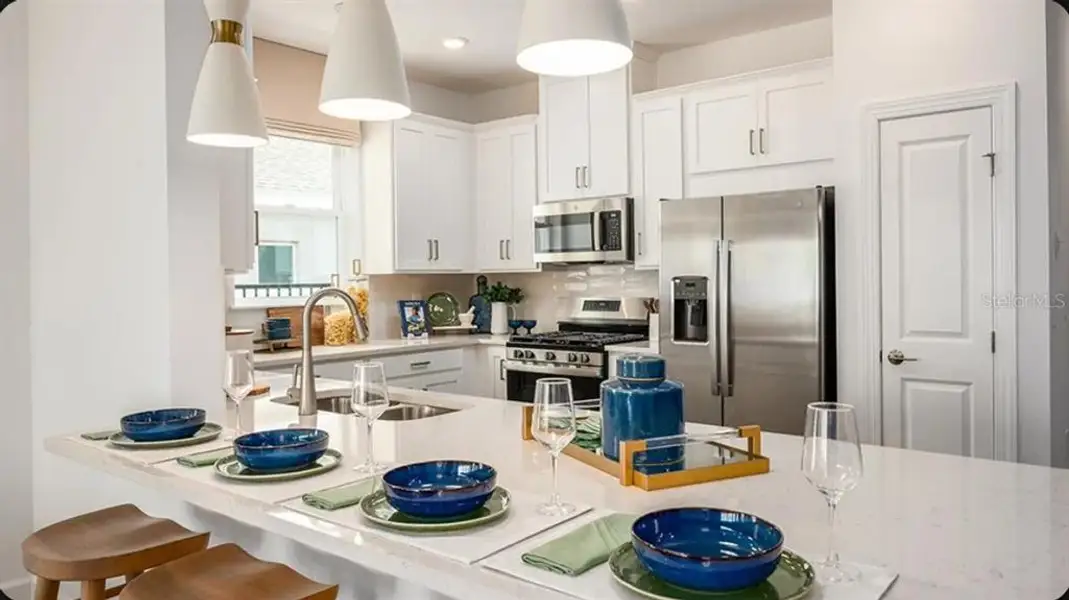 Furnished interior view inside a new home in Esplanade at McKinnon Groves, Winter Garden (Image 3).
