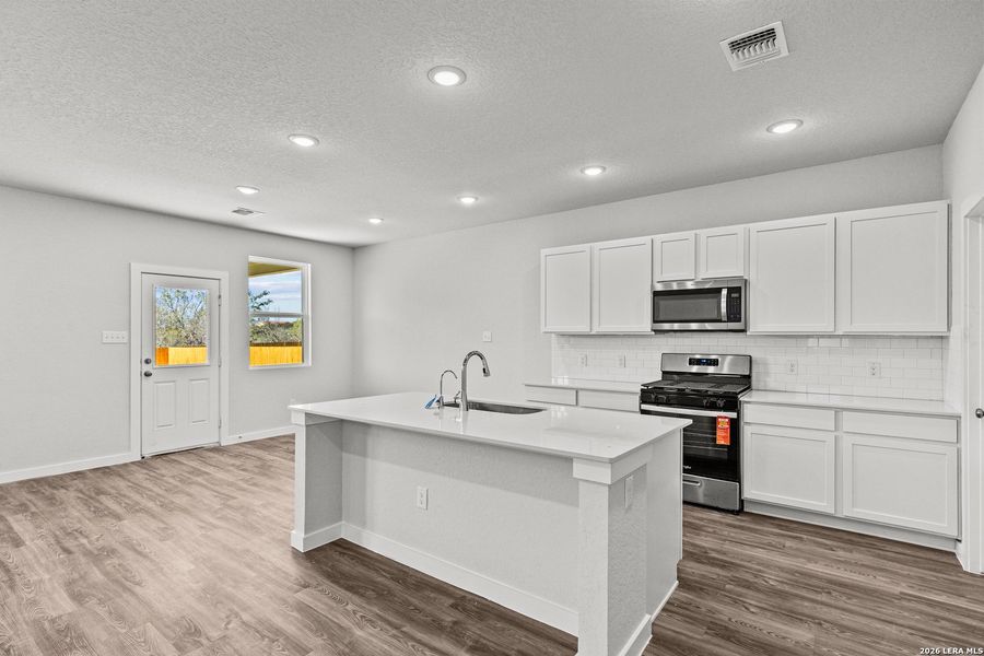Furnished interior view inside a new home in Hacienda, San Antonio (Image 4).