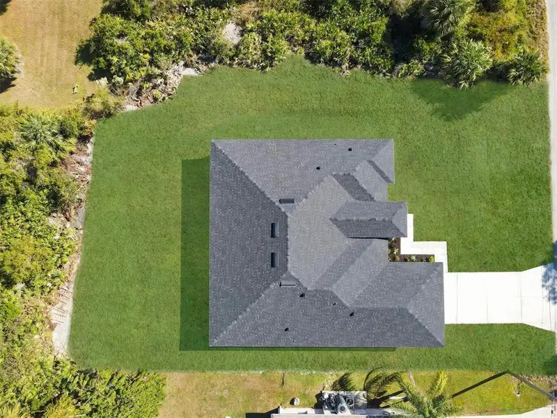 Front exterior of a new home in , North Port, FL, highlighting curb appeal (Image 2). Front exterior of a new home in , North Port, FL, highlighting curb appeal (Image 2).