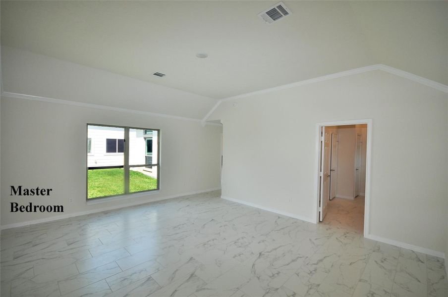 Master Bedroom ceiling vaults to 10 foot and is located privately to the rear of the home.