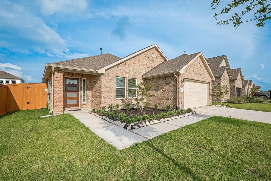 Front exterior of a new home in Lago Mar, Texas City, TX, highlighting curb appeal (Image 18).