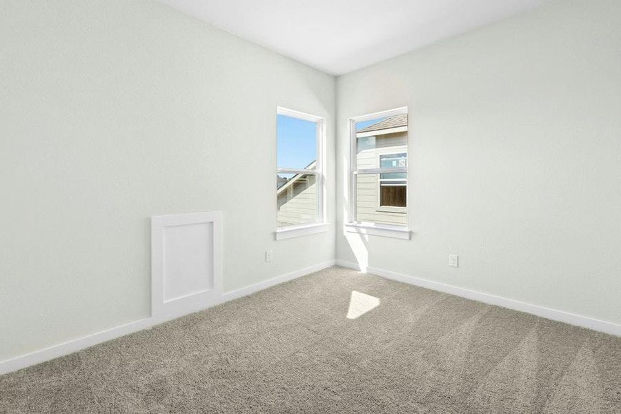 Carpeted empty room featuring baseboards