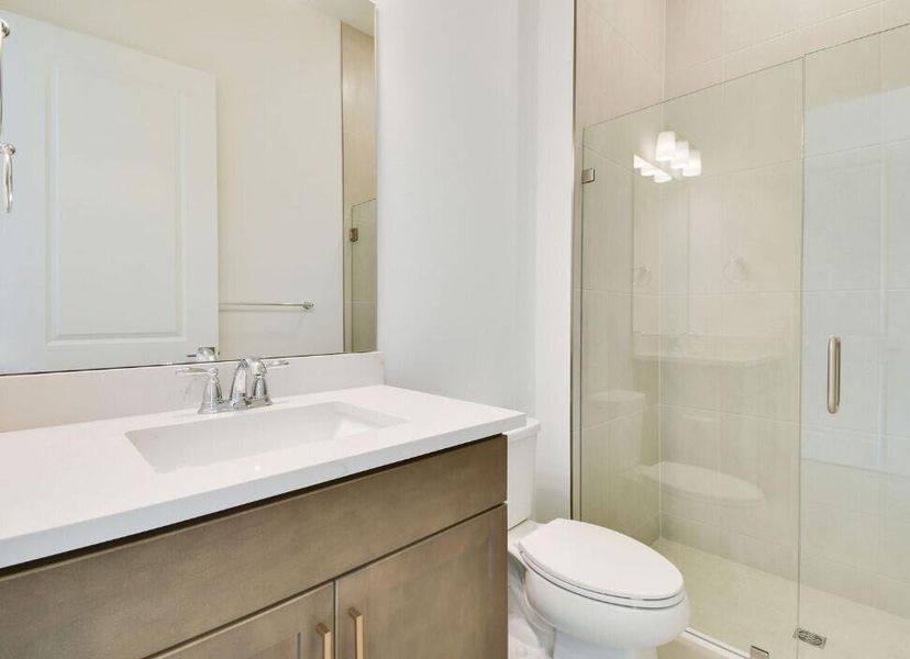 Front exterior of a new home in Greyhawk Landing, Lake Worth, FL, highlighting curb appeal (Image 1).