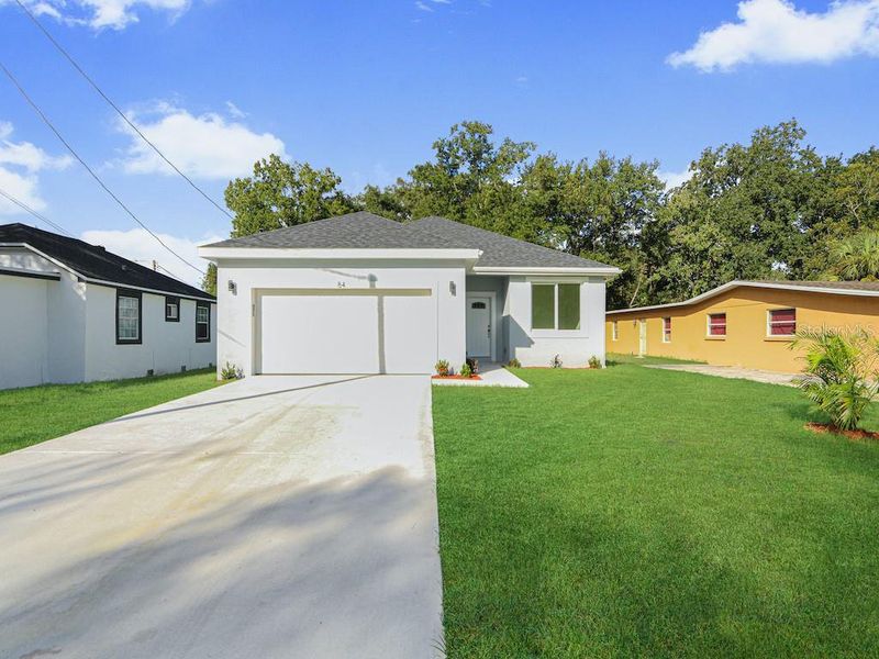 Front exterior of a new home in , Orlando, FL, highlighting curb appeal (Image 2). Front exterior of a new home in , Orlando, FL, highlighting curb appeal (Image 2).