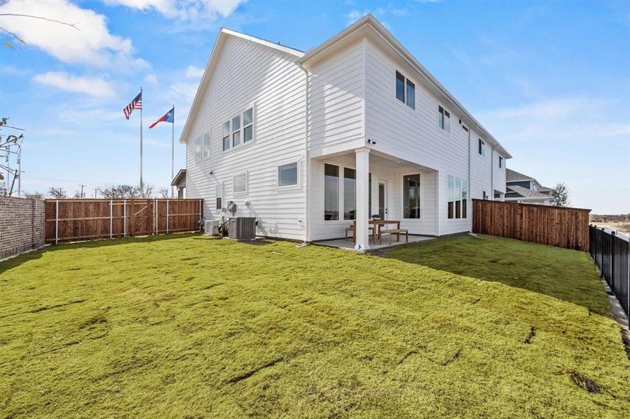 Exterior details and patio area of a home in North Square at Uptown, Celina (Image 2).