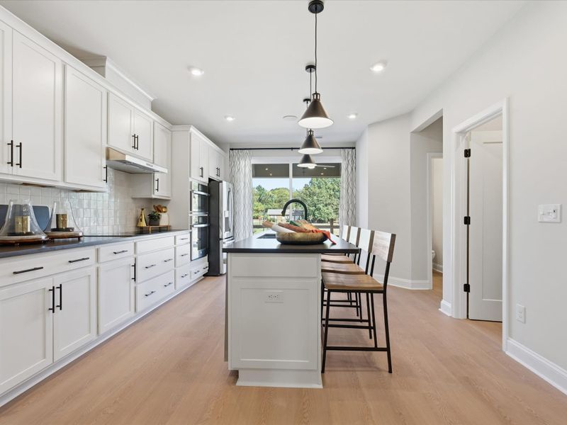 Representative furnished interior of a home built from the Dahlia by Tri Pointe Homes in Bellflower, Charlotte (Image 18).