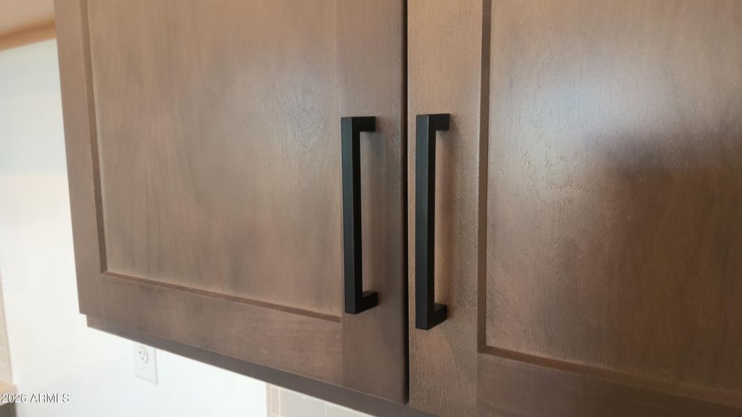 Matte black cabinet pulls throughout