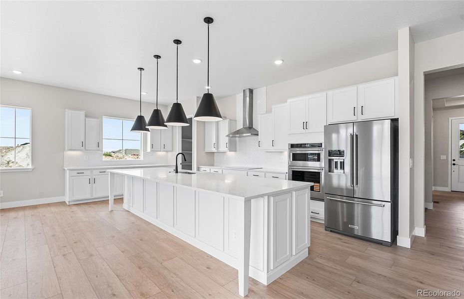 Furnished interior view inside a new home in Hilltop at Inspiration, Aurora (Image 15).