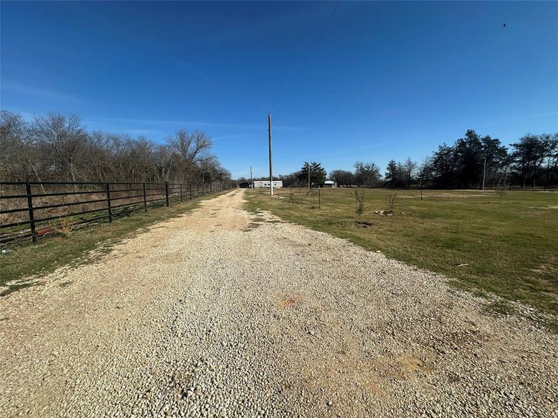 Driveway continuing to back of Property