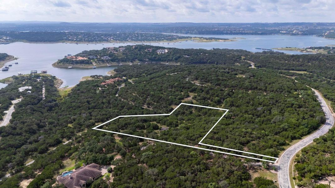 A sprawling, wooded lot with lake views, awaiting your vision for a secluded estate. A sprawling, wooded lot with lake views, awaiting your vision for a secluded estate.