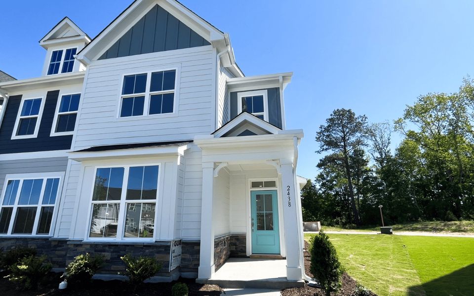 Front exterior of a new home in Wendell Falls, Wendell, NC, highlighting curb appeal (Image 2). Front exterior of a new home in Wendell Falls, Wendell, NC, highlighting curb appeal (Image 2).