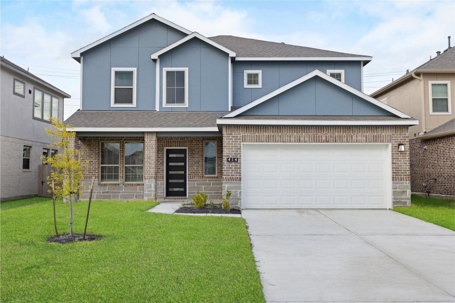 Front exterior of a new home in Kendall Lakes, Alvin, TX, highlighting curb appeal (Image 2).