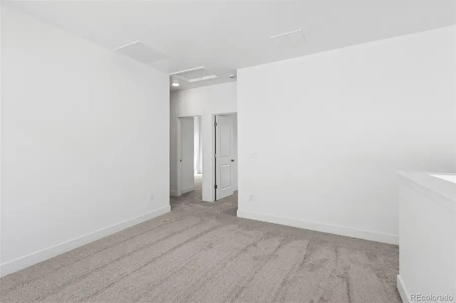 Spacious, unfurnished interior of a new home in Painted Prairie Cottage, Aurora (Image 37).