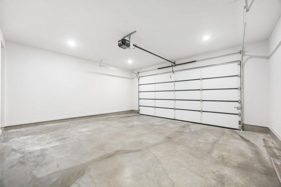 Garage comes with storage, tankless water heater, pre-plummed for a water softener, and garage door opener.