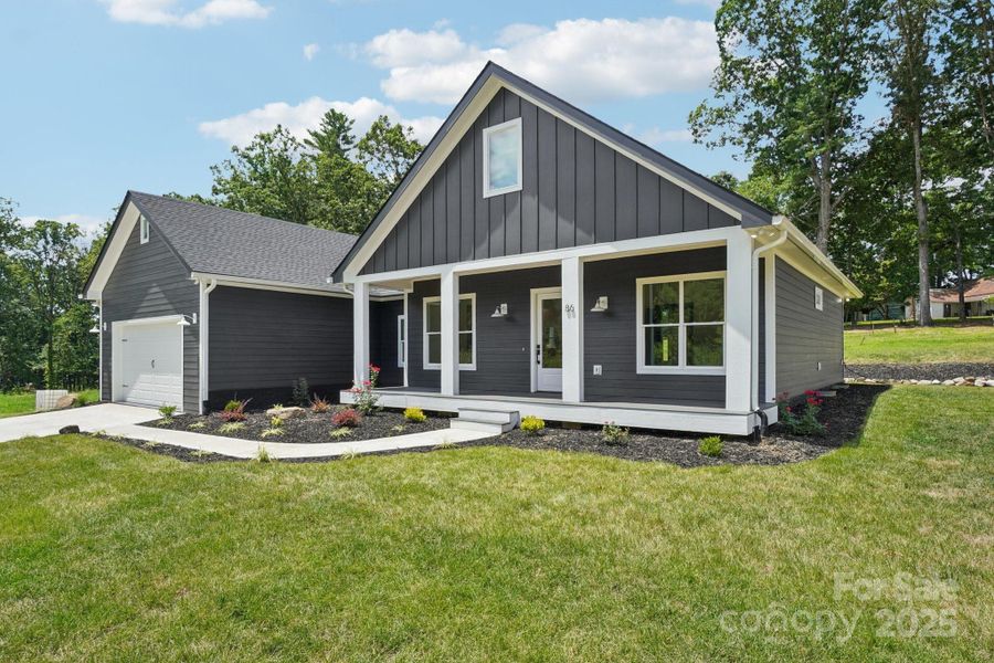 Front exterior of a new home in , Hendersonville, NC, highlighting curb appeal (Image 24).