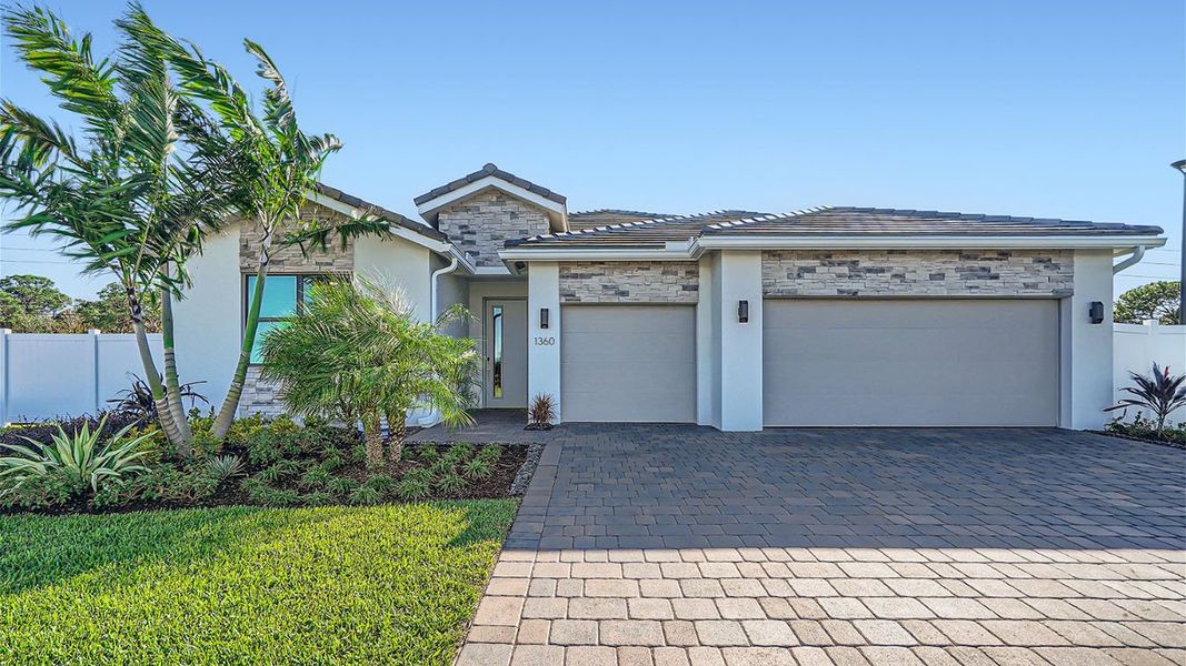 Representative exterior photo of a completed home built from the Camden by D.R. Horton in Estrella Square, Homestead, FL (Image 1).