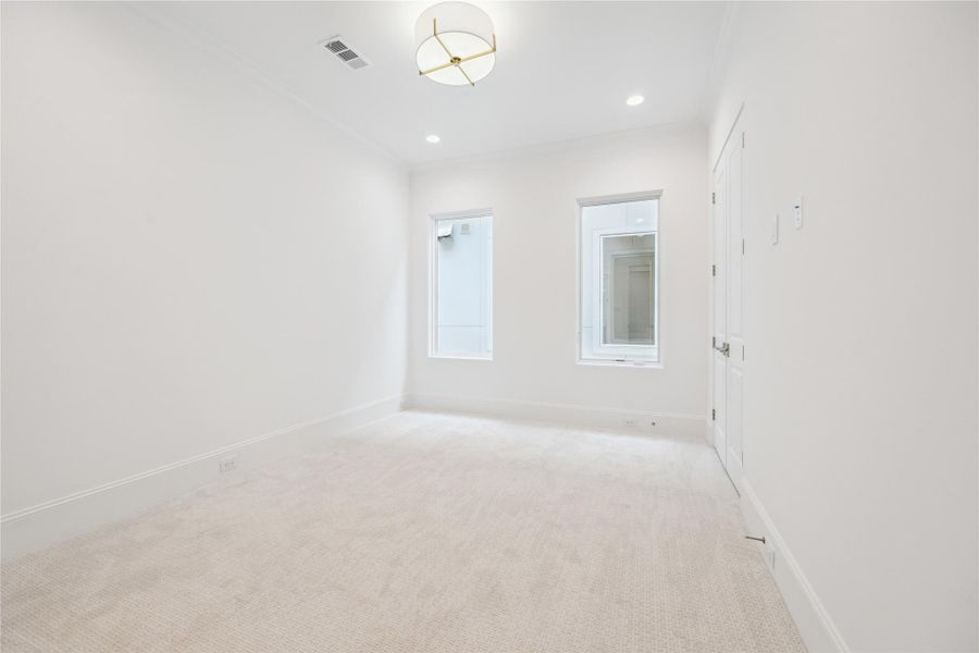 The final second-floor bedroom features Dreamweaver Pinpoint high-performance carpet and Luce aged-brass light fixture with linen shade with spacious closet. The final second-floor bedroom features Dreamweaver Pinpoint high-performance carpet and Luce aged-brass light fixture with linen shade with spacious closet.