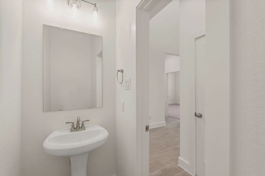 Representative furnished interior of a home built from the St Andrews by Chesmar Homes in Riceland Alley Loads, Mont Belvieu (Image 15).
