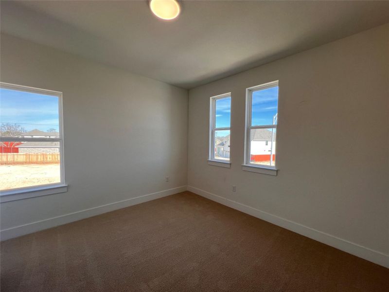 Unfurnished room with baseboards and carpet flooring