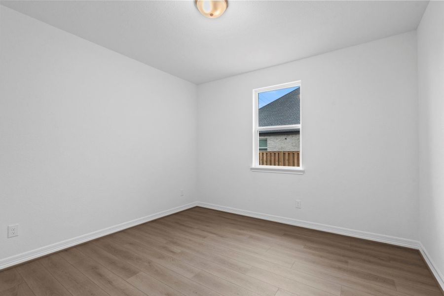 The home office features beautiful floors, large windows that give a fresh feel, this space promotes focus and creativity.