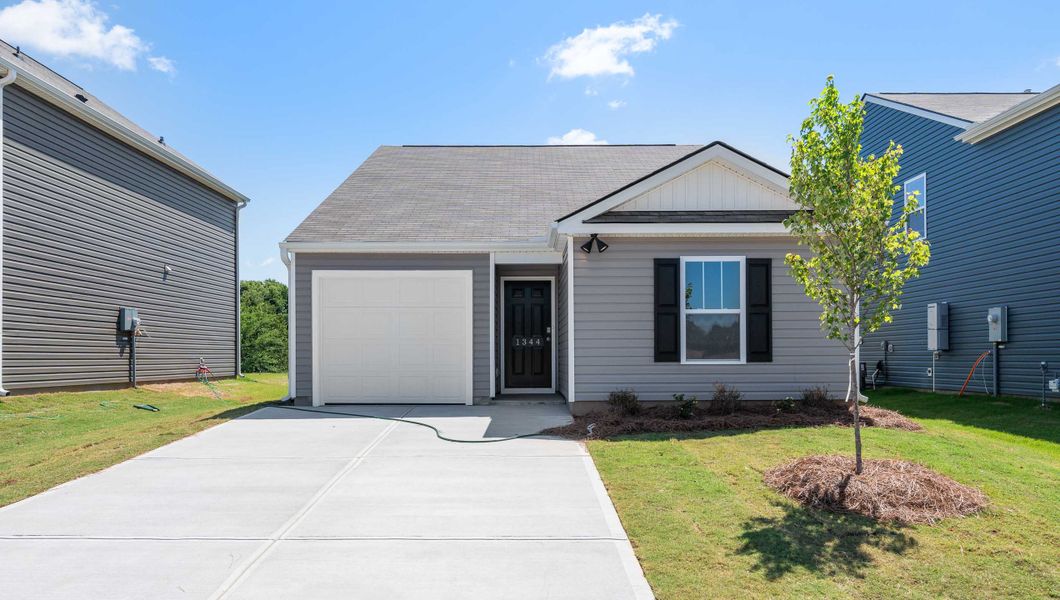 Front exterior of a new home in Gibson Grove, Laurens, SC, highlighting curb appeal (Image 1).