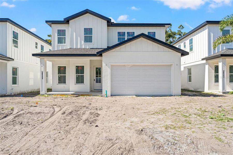 Front exterior of a new home in , Seminole, FL, highlighting curb appeal (Image 2).